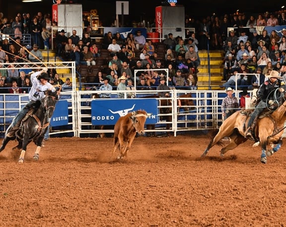 Team Ropers roping at Rodeo Austin