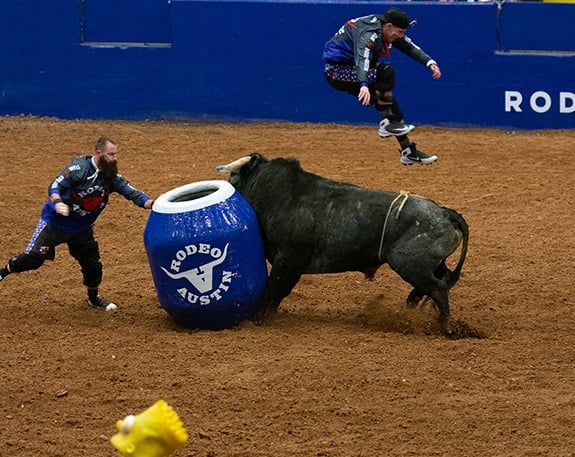 bullfighter jumping over a bull