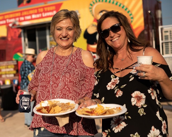 Happy Volunteers enjoying the food trucks at Rodeo Round-Up party
