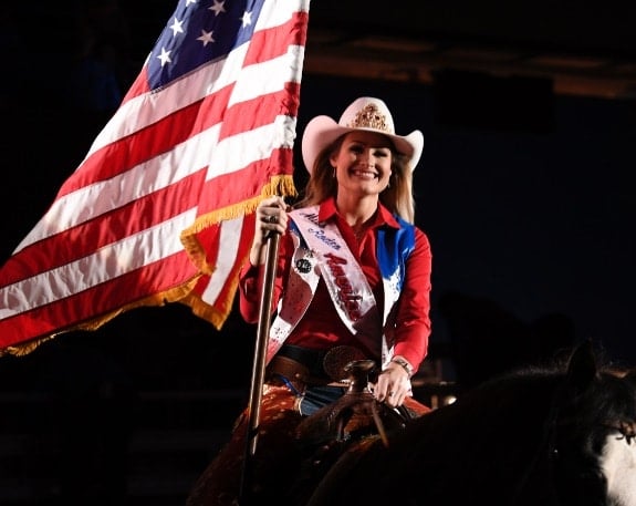 rodeo queen on horse with USA Flag