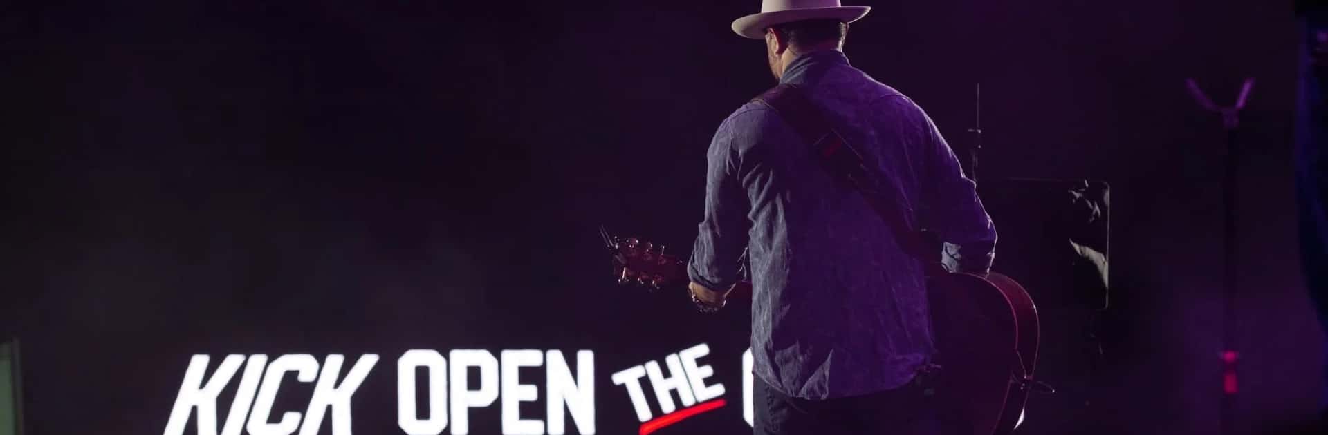Wade Bowen performing live at Rodeo Austin from the arena floor at Kick Open the Chutes.