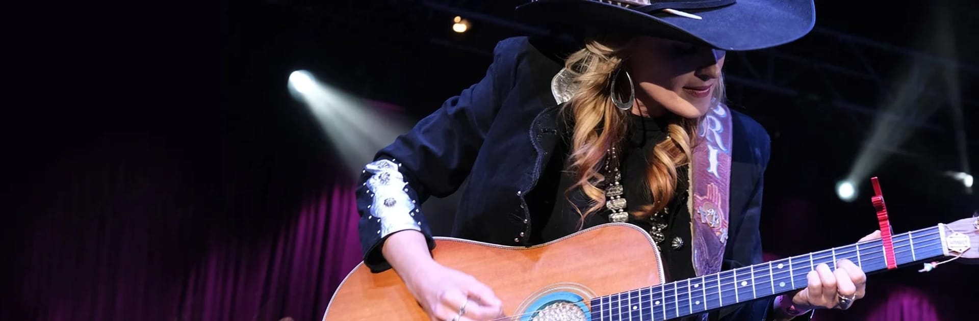 Bri Bagwell playing guitar at Rodeo Austin Gala 2020